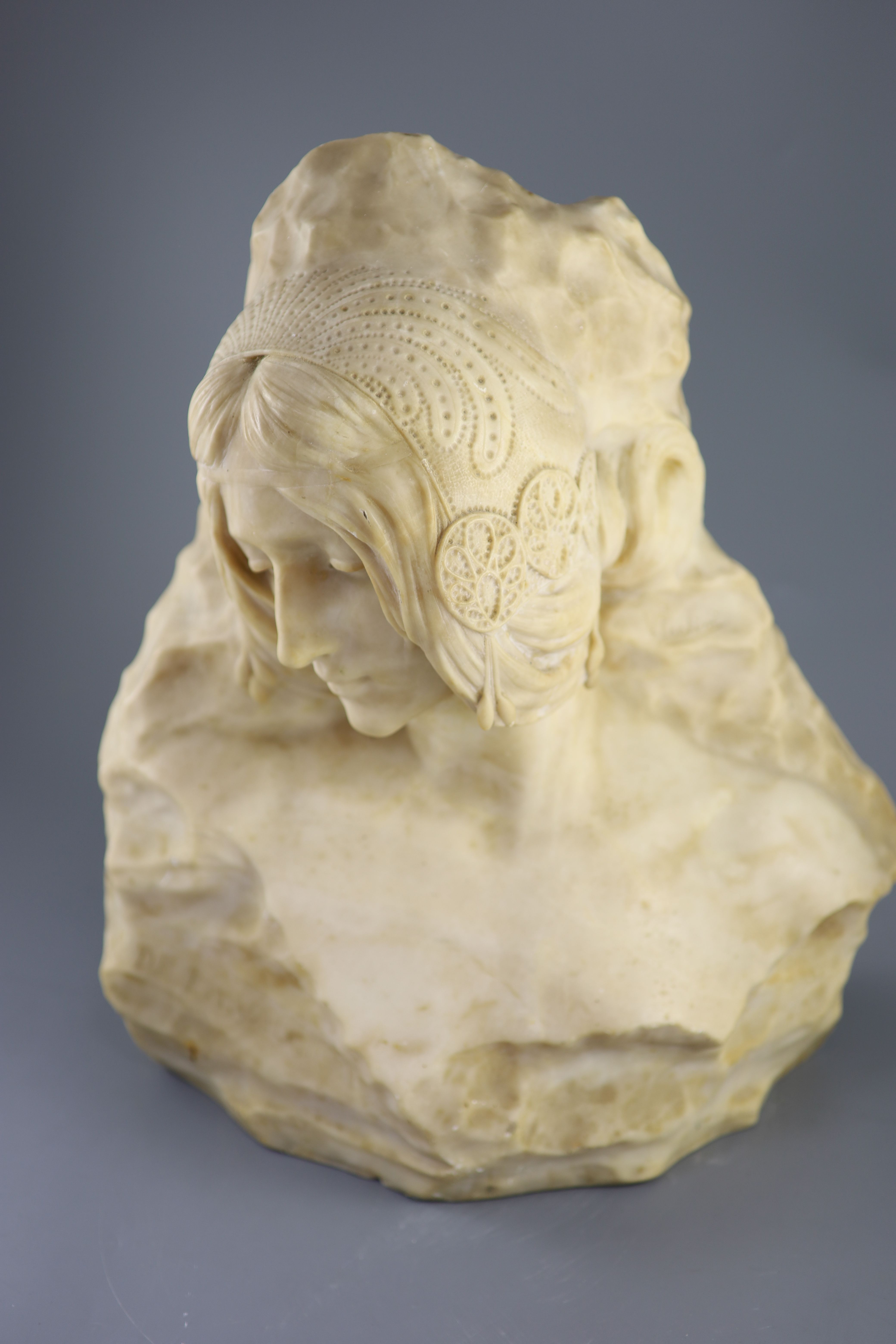 Galileo Pochini (19th C.). A carved alabaster bust of a medieval lady, height 18in.